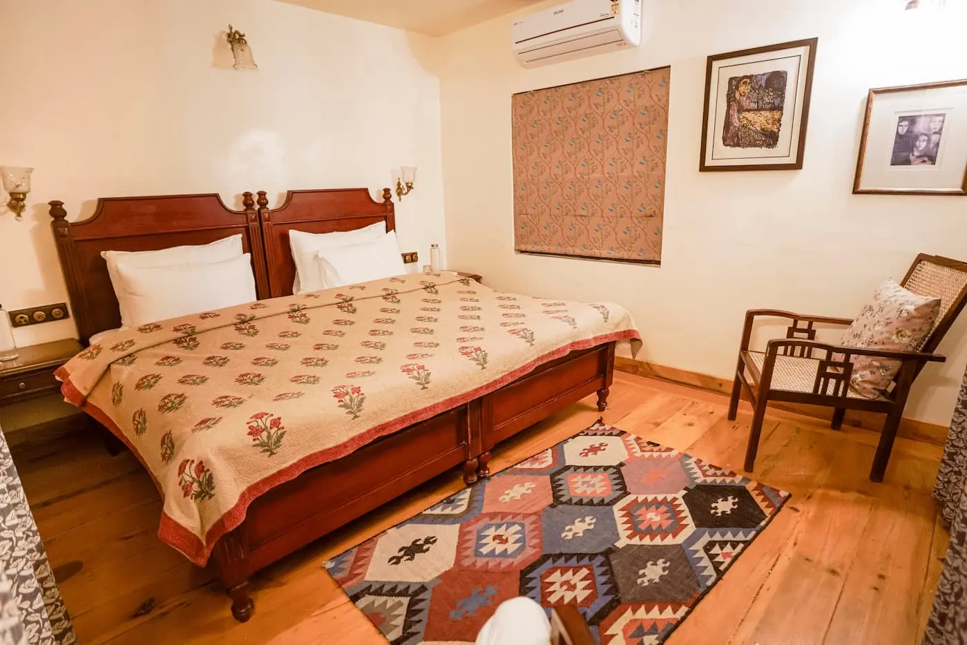 Carved wooden beds with block-print quilts in the Classic Heritage Room, Two Chimneys Gethia