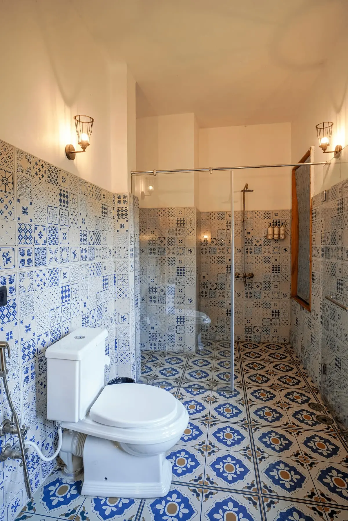 Blue patterned-tile bathroom with walk-in shower in the Deluxe Valley Room, Two Chimneys