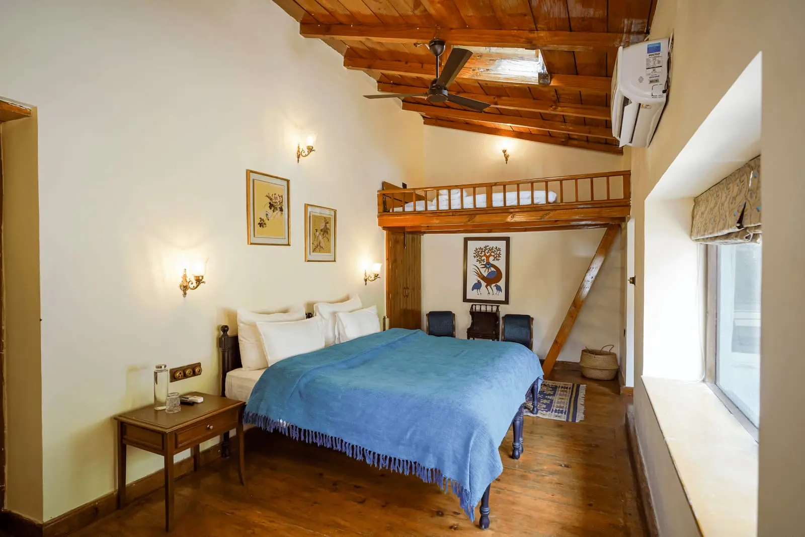 Living and dining spaces with fireplaces at Two Chimneys, Gethia near Nainital