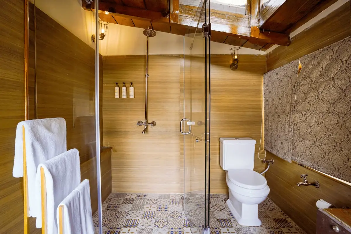 Skylit bathroom with stone basin in the Family Loft Room at Two Chimneys, Gethia