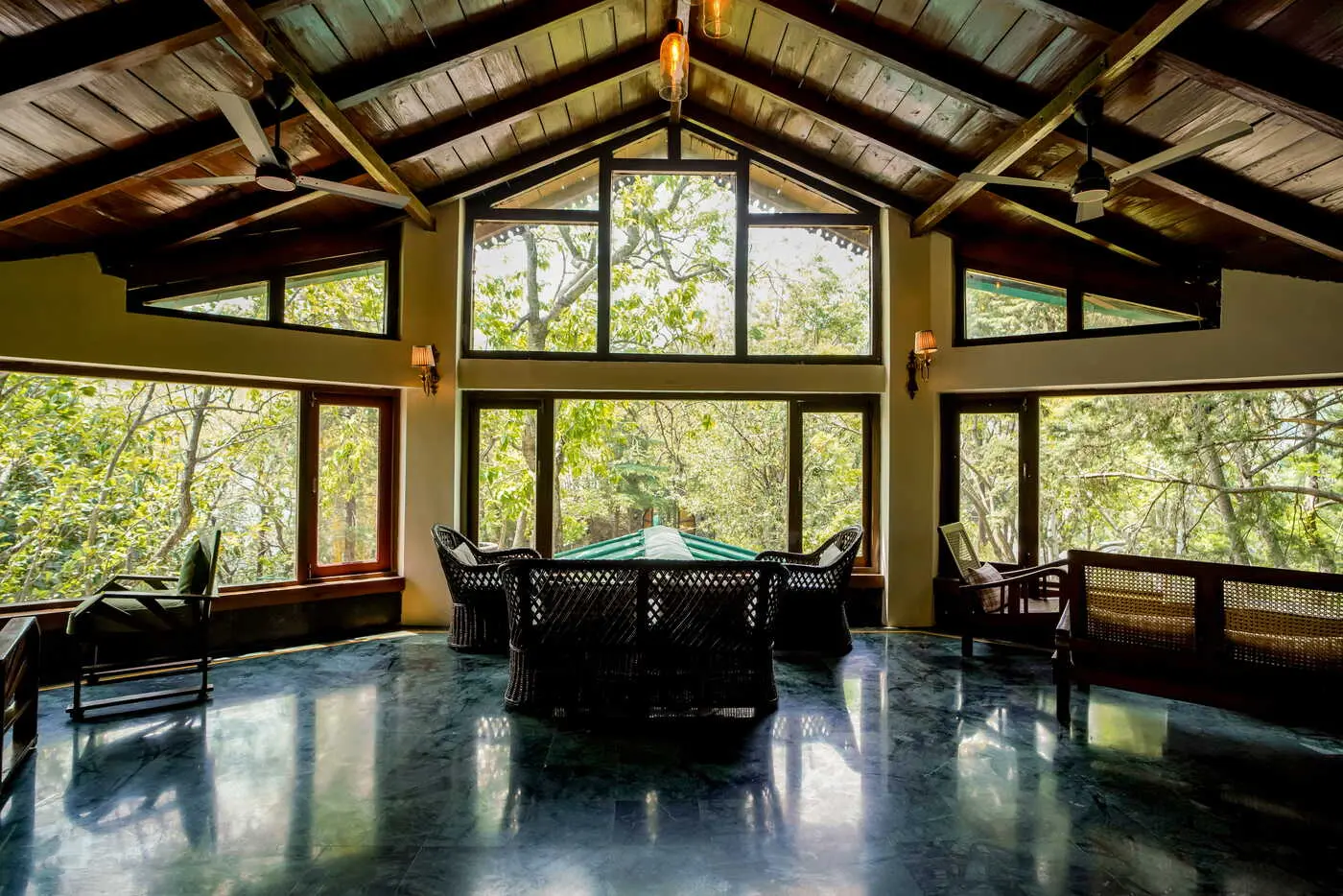 Lounge with cathedral windows overlooking the forest at Two Chimneys, Gethia