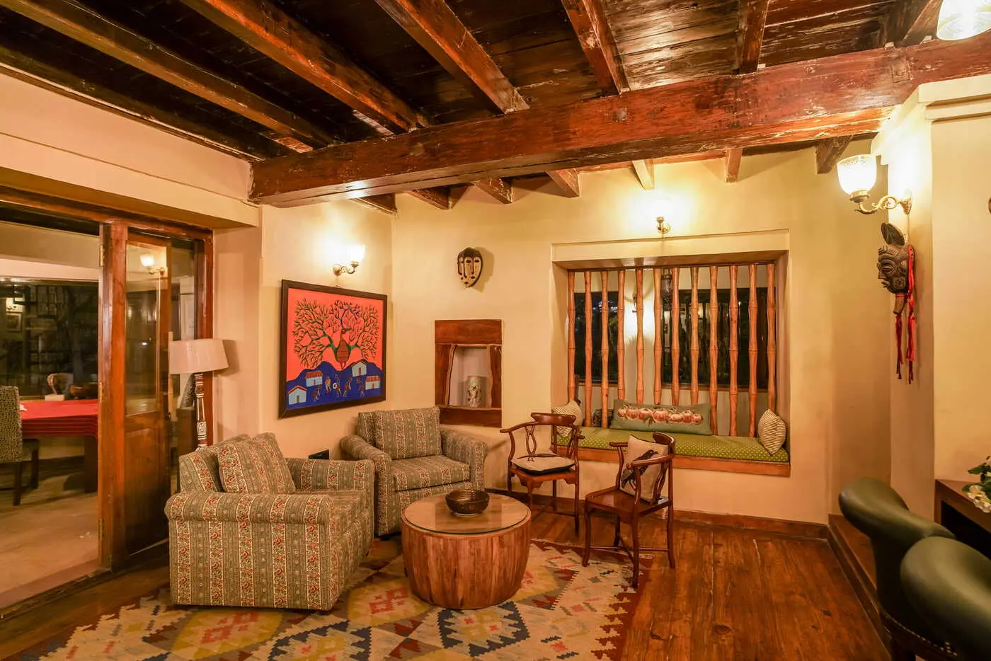 Cosy sitting room with window seat inside the heritage bungalow, Two Chimneys Gethia