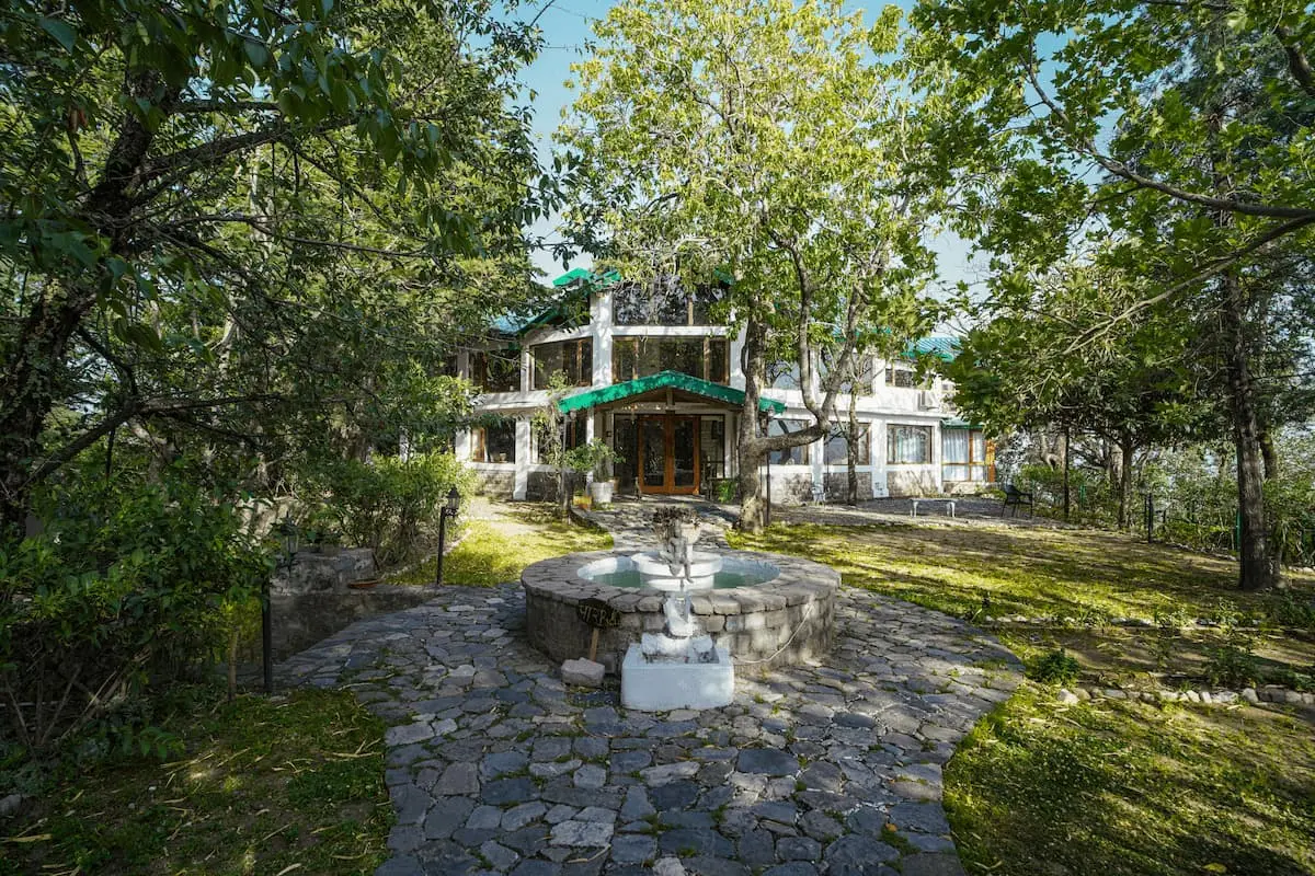 Stone fountain courtyard in front of the heritage bungalow at Two Chimneys, Gethia