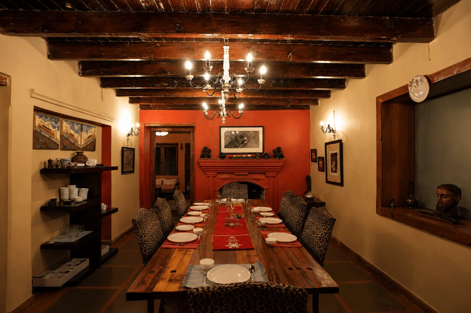 Living and dining spaces with fireplaces at Two Chimneys, Gethia near Nainital